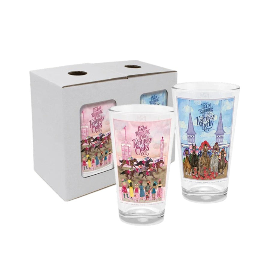 The 152nd Kentucky Derby and Oaks pint glasses displayed next to their light grey packaging box, highlighting the detailed, full-color wraparound horse racing artwork by Grayson Reynolds.