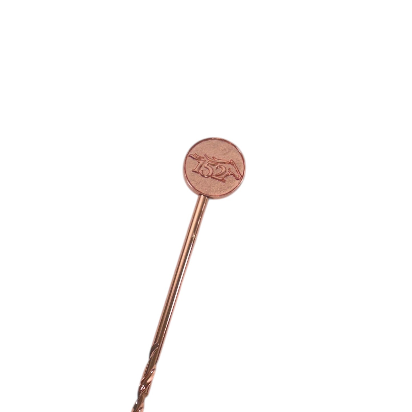 A sharp close-up view of the Official 152nd Kentucky Derby copper metal stirrer stick, highlighting the circular top featuring the embossed number 152 and a horse head outline.