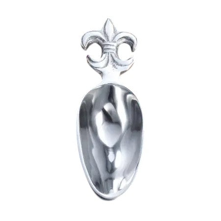 Silver spoon with a fleur-de-lis design on a white background