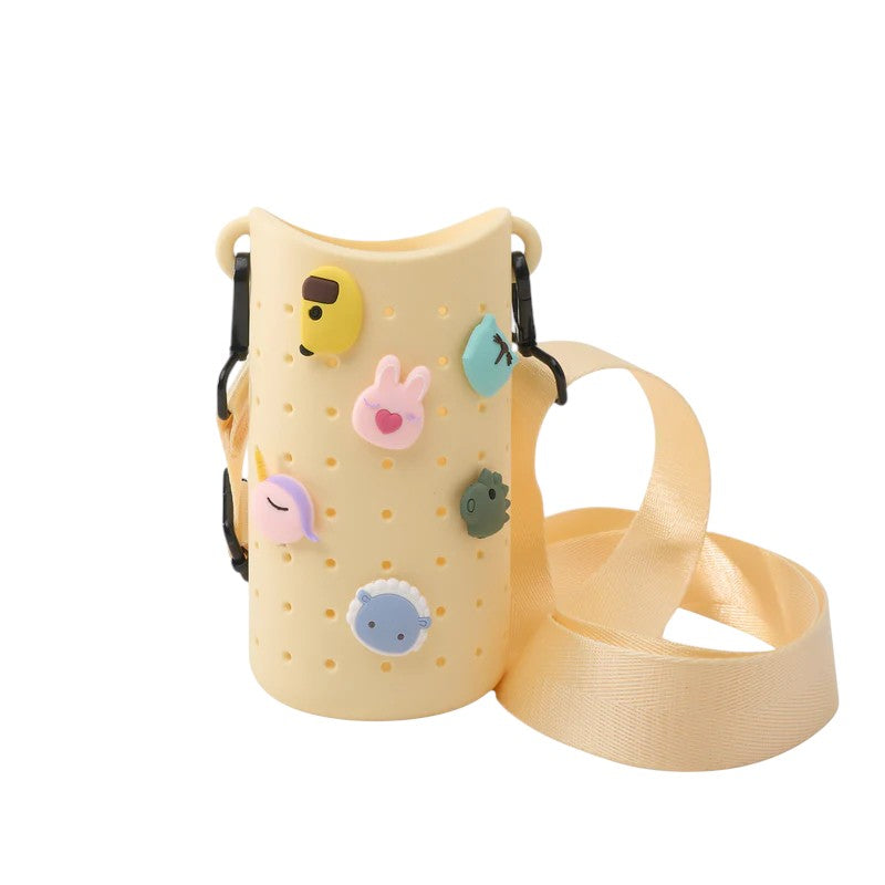A close-up of the five collectible charms included with the yellow Bestie Sling
