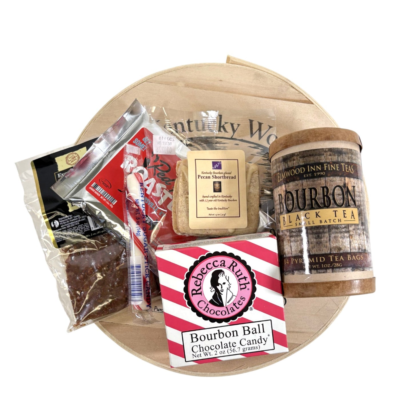 A top-down view of all items in the Let Them Eat Bourbon Gift Set, showing the cake, bourbon balls, shortbread, and coffee.