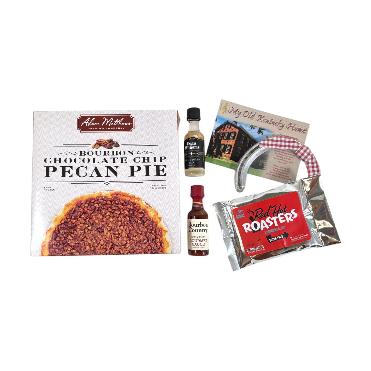 A top-down view of the gift set contents including a Bourbon Chocolate Chip Pecan Pie, mint julep mix, and a horseshoe.