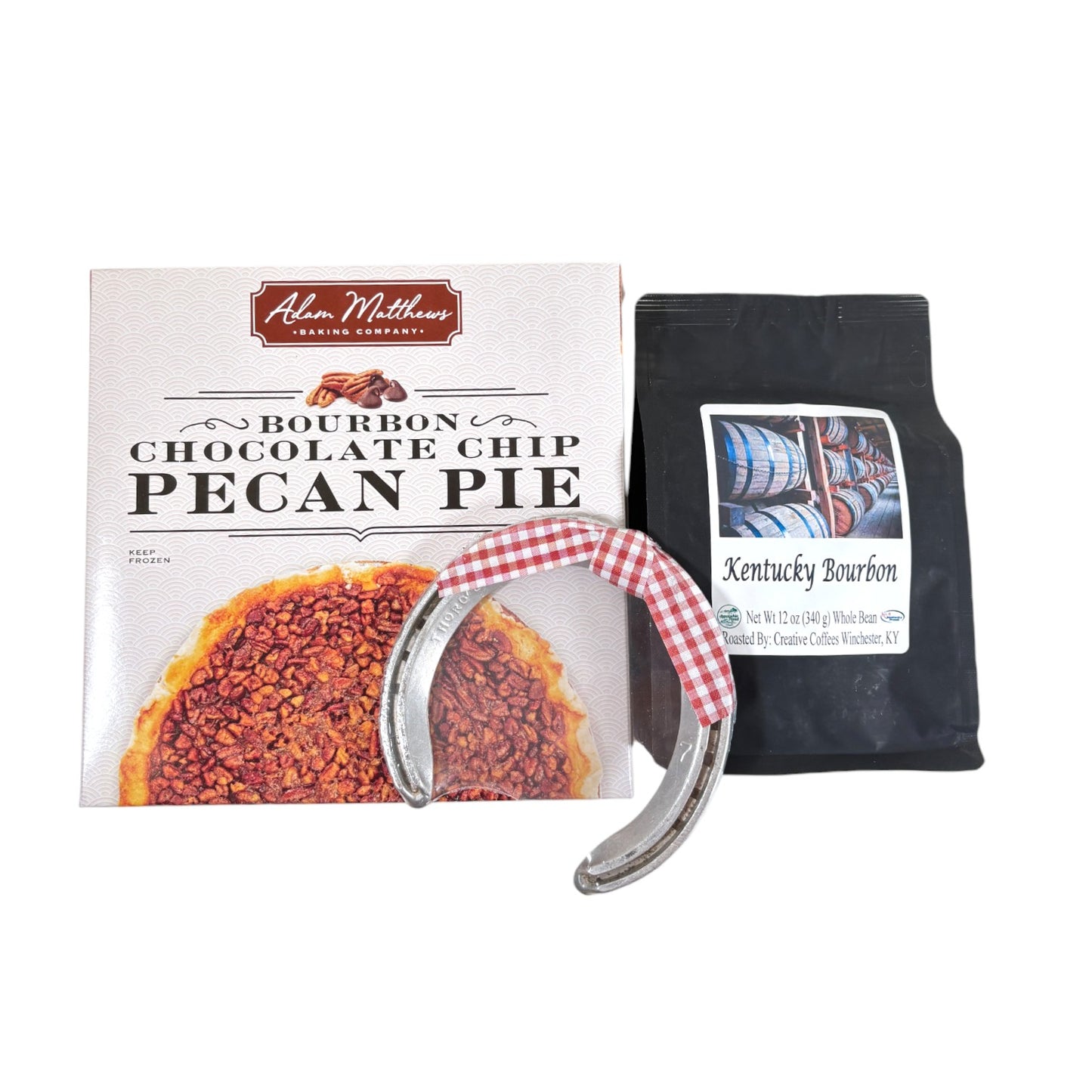A top-down view of the gift box contents: a Bourbon Chocolate Chip Pecan Pie, a 12oz bag of coffee, and a Churchill Downs horseshoe.