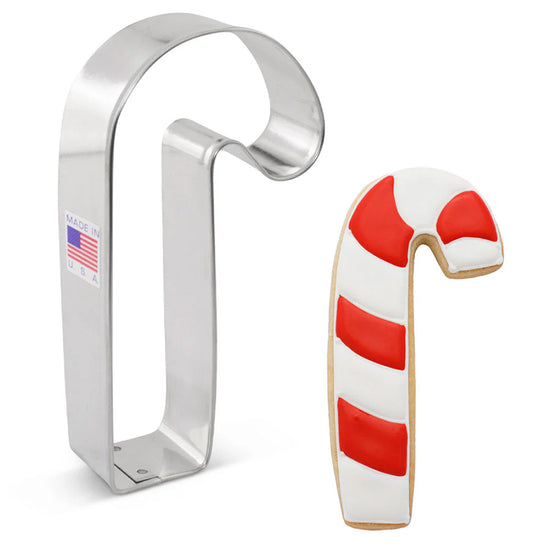 Candy cane-shaped cookie cutter with a candy cane-shaped cookie on a white background