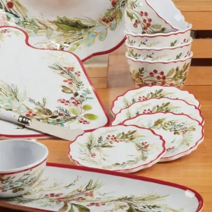 Set of decorative ceramic plates with floral patterns on a wooden surface