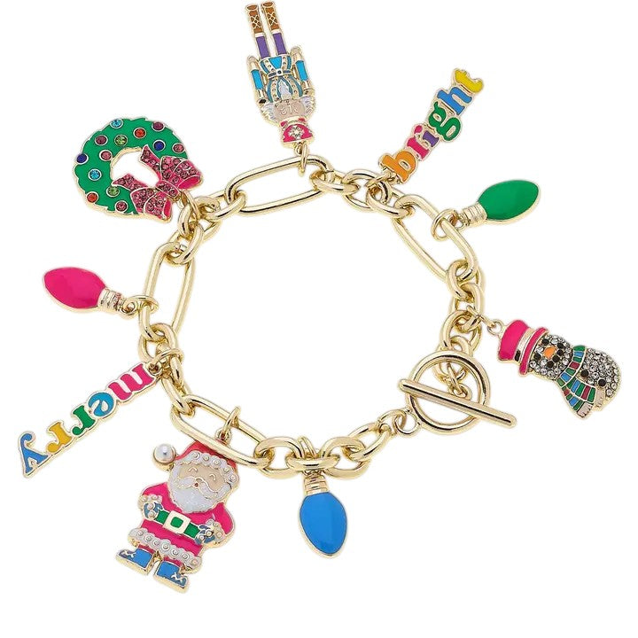 A gold charm bracelet with colorful enamel Christmas icons like a snowman, nutcracker, and Santa.