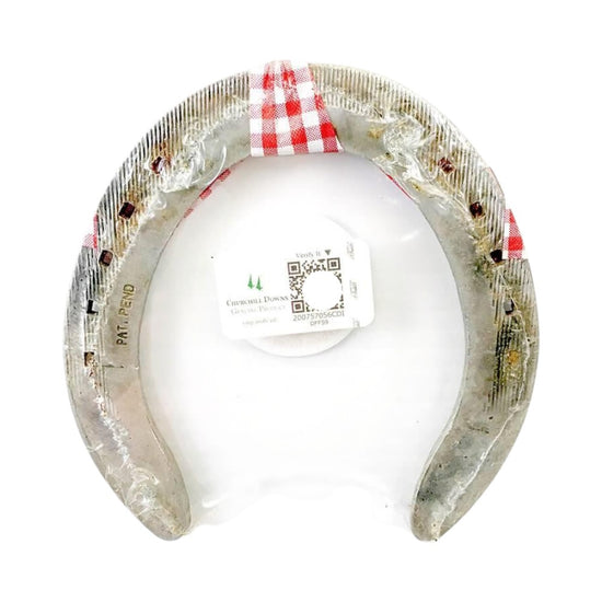 Decorative horseshoe with a white ball inside, on a white background