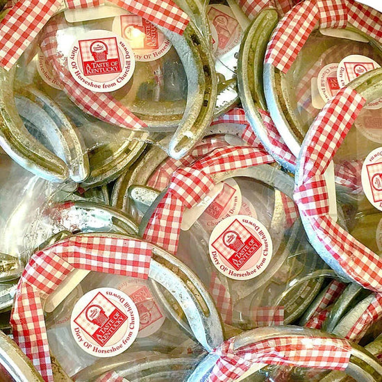 Horseshoes with red and white checkered ribbons and visible branding.