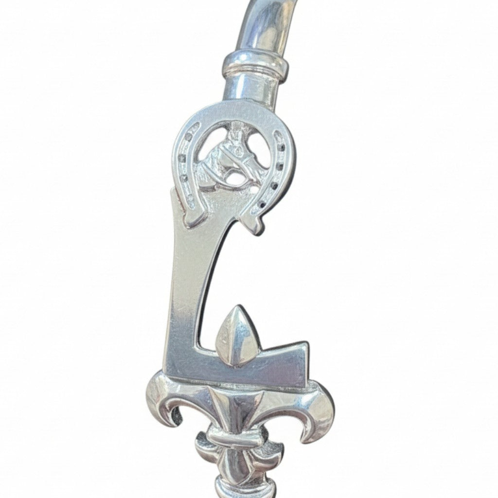 Silver bracelet with decorative clasp on a white background