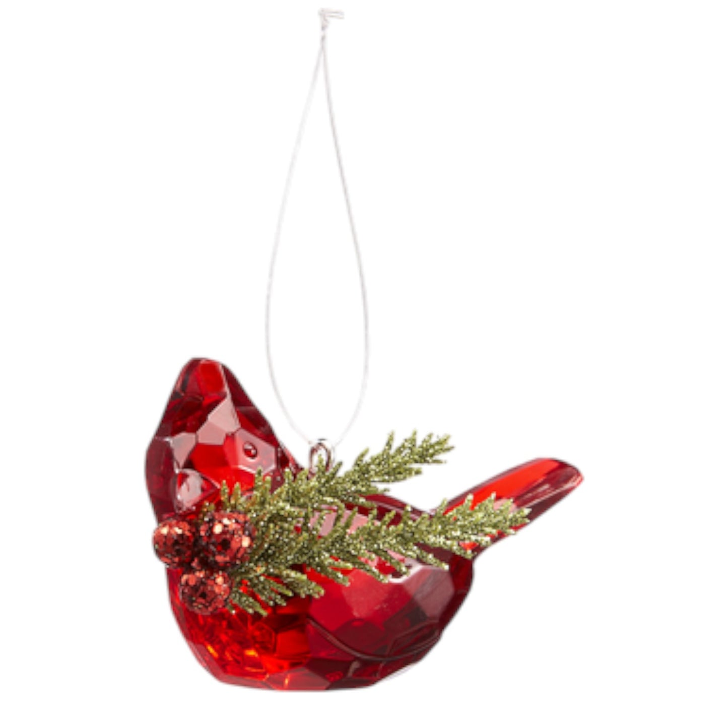 Red glass bird ornament with greenery on a white background