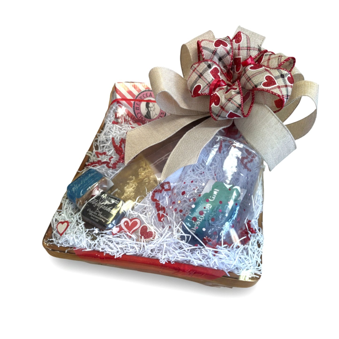 The Sip & Savor Gift Basket beautifully arranged, featuring a wine chiller, a stemless wine glass, and Kentucky bourbon sweets.