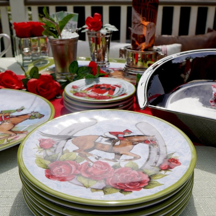 A lifestyle photo of the "Day at the Races" salad plates used in a table setting for a Derby party, mixed with other items from the collection.