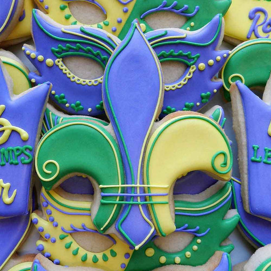 Elegant fleur-de-lis cookies Decorative cookies with Mardi Gras theme featuring purple, green, and yellow colors.
