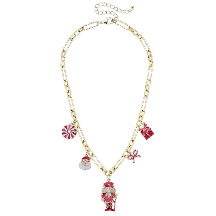 The gold-tone charm necklace featuring a nutcracker, Santa, and other festive enamel charms.