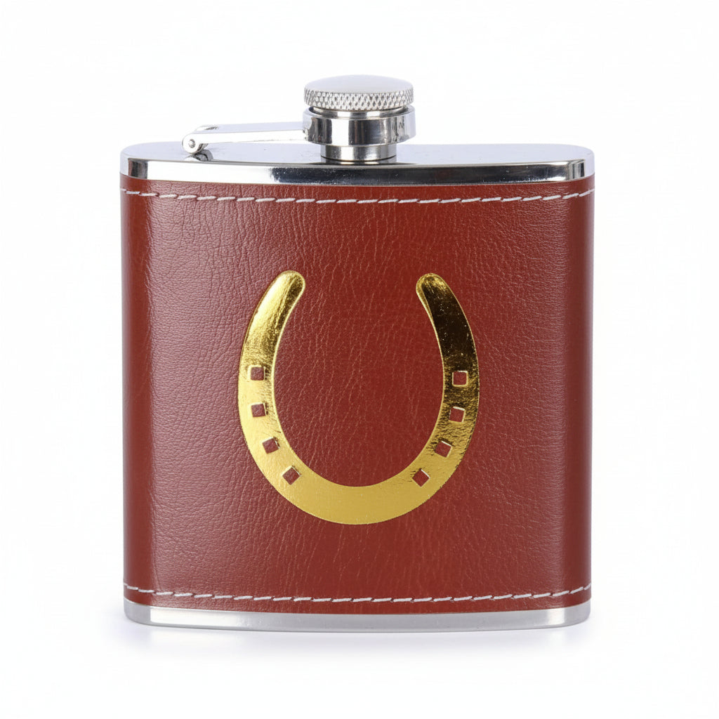 Close-up of the horseshoe design faux leather flask showing the intricate gold foil detail and white stitching.