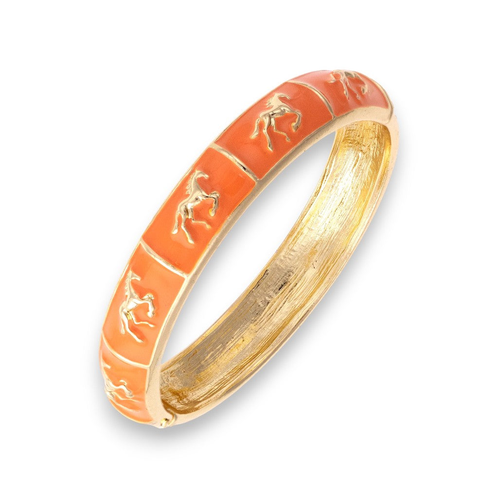 Close-up of the Horsin' Around Bangle in orange enamel.