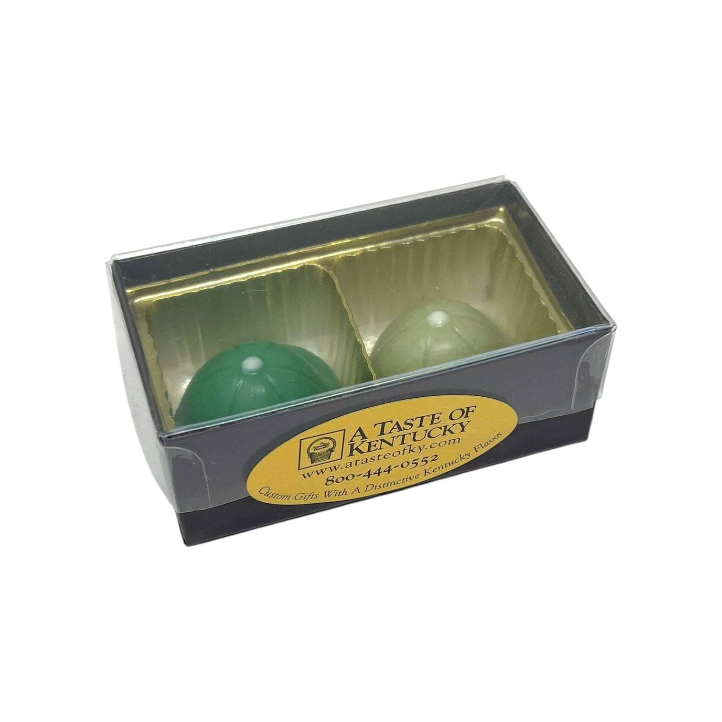 Two green chocolate jockey caps in a clear box with 'A Taste of Kentucky' label on a white background