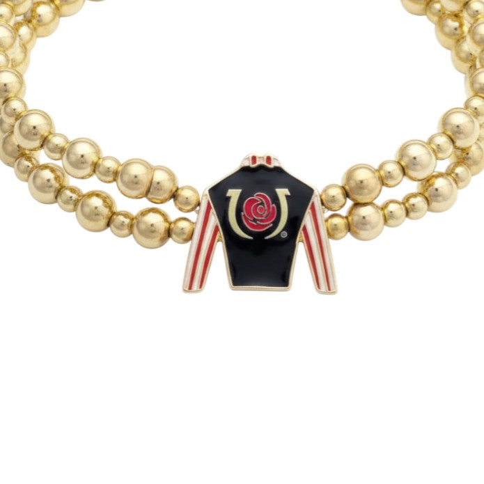 A close-up of the enamel jockey silk charm with its black, red, and white "Run for the Roses" design.