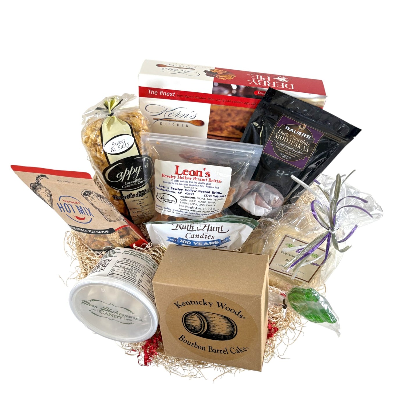 An overhead flatlay showing all the items in the Barrel of Goodness gift basket, including a Derby Pie, Bourbon Barrel Cake, and various candies.