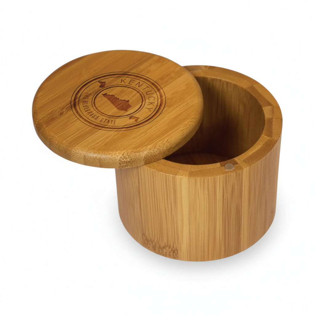 The round bamboo Kentucky State Stamp Series Salt Box featuring an engraved lid with the state shape and horse icons.