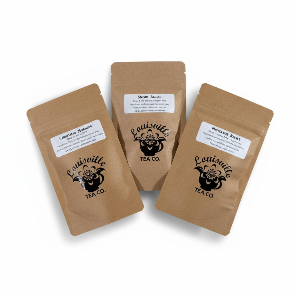 A group photo of all three Louisville Tea Co. seasonal tea pouches: Mistletoe Kisses, Christmas Morning, and Snow Angel.