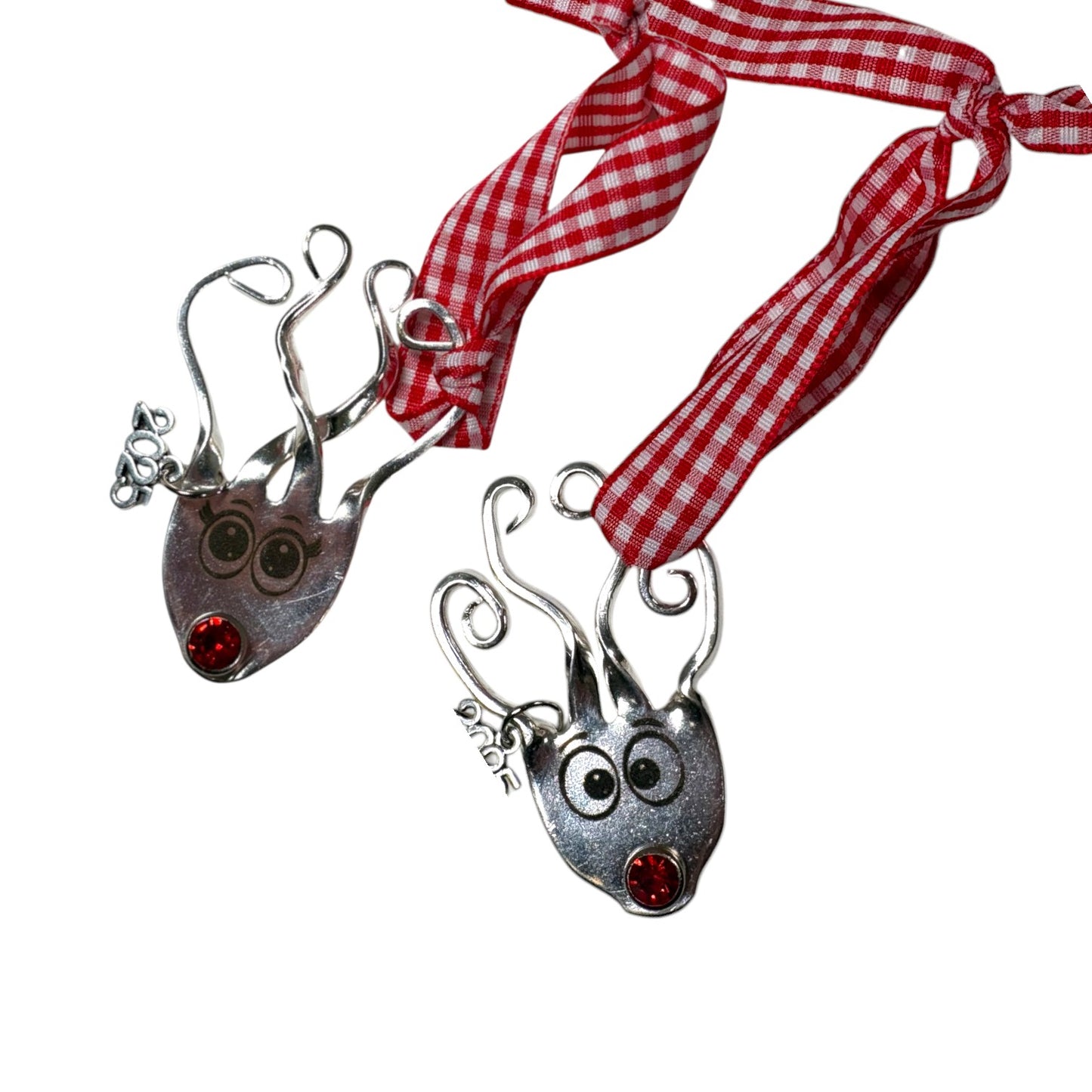 A pair of Boy and Girl Reindeer ornaments shown together as a set.