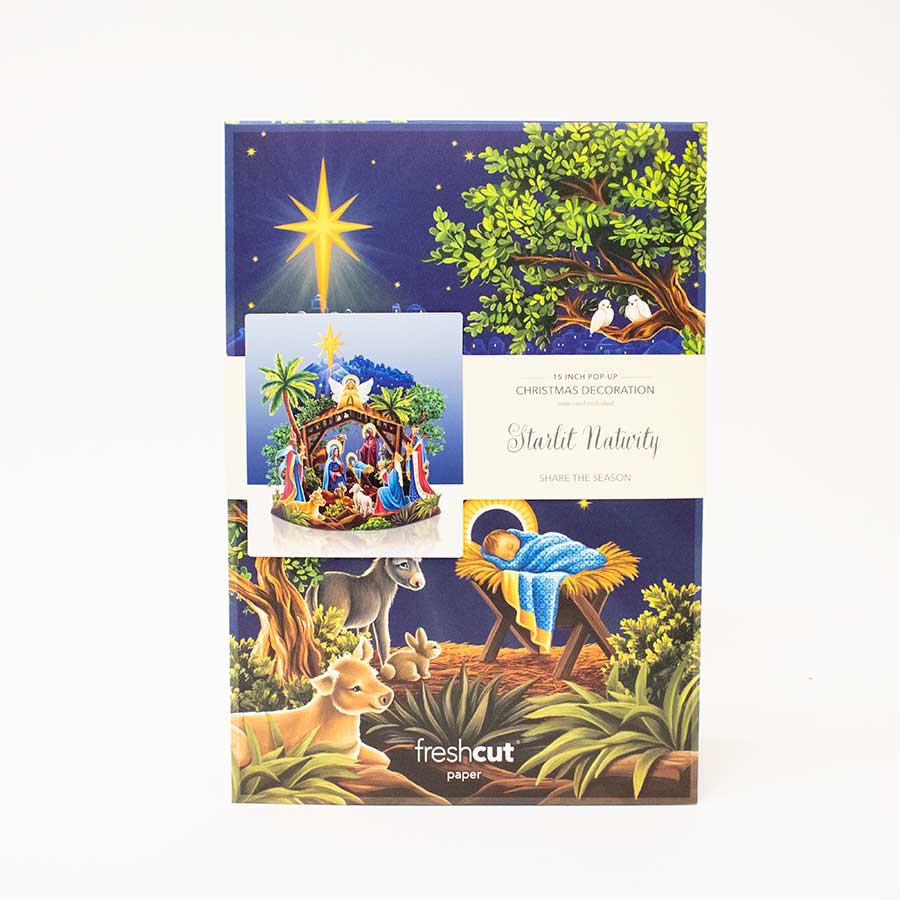 Packaging of Christmas decorations featuring a nativity scene and star of Bethlehem illustration.