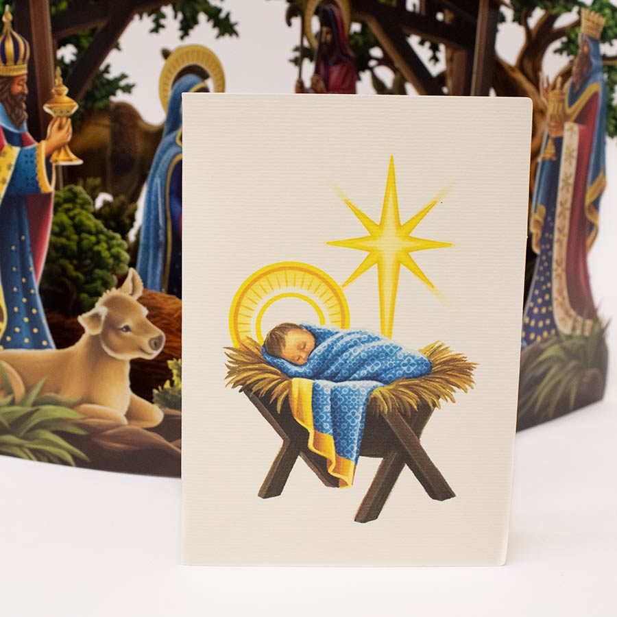 Nativity scene with baby Jesus in a manger, surrounded by three wise men and an ox.