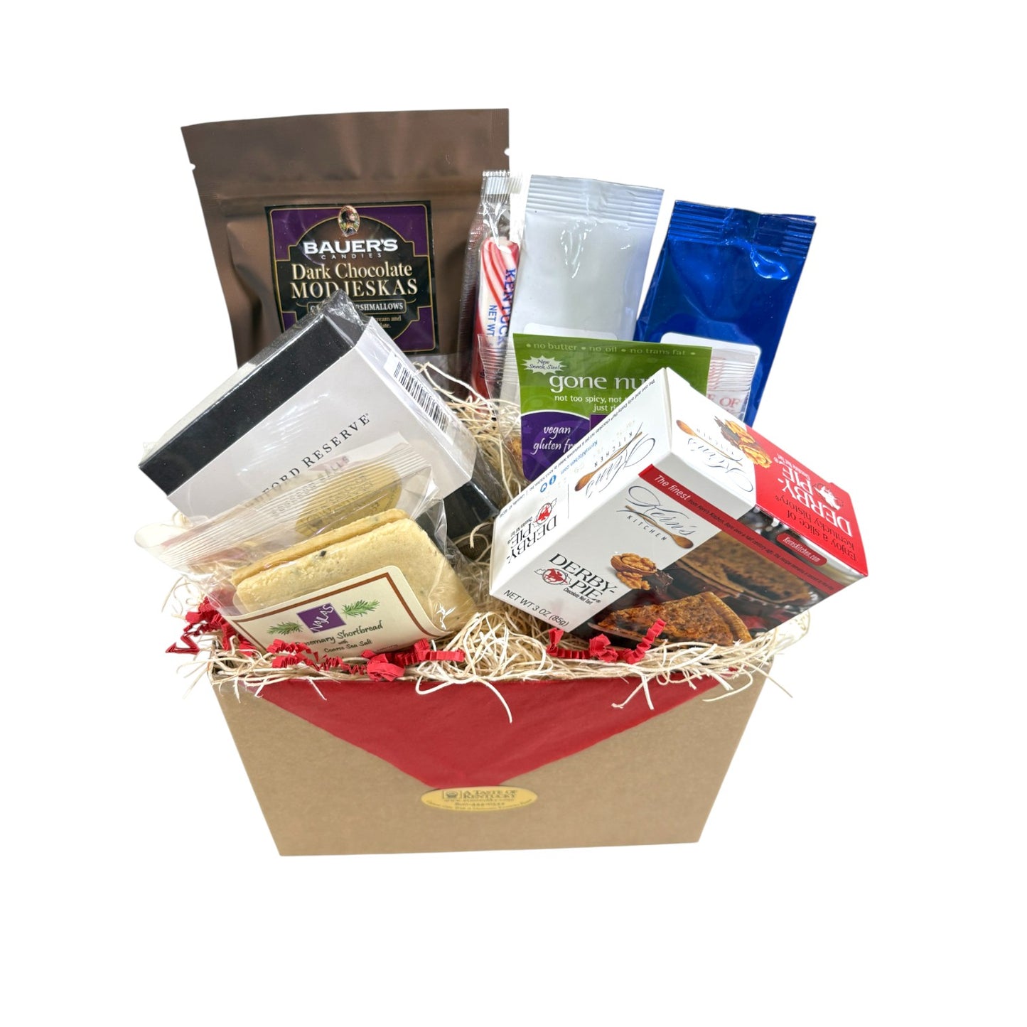 A top-down view of all the items in the Sweet Sampler Gift Box, showing the variety of chocolates, snacks, coffee, and candy.