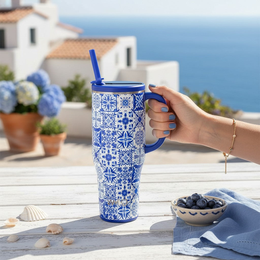Swig Life Indigo Tiles Mega Mug styled in a bright coastal setting with European summer-inspired blue and white accents.