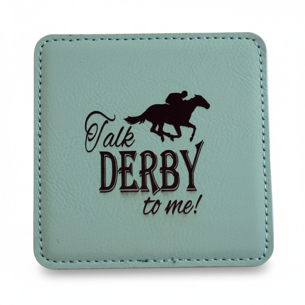 A square mint green faux leather coaster featuring a dark brown jockey silhouette and "Talk DERBY to me!" text.