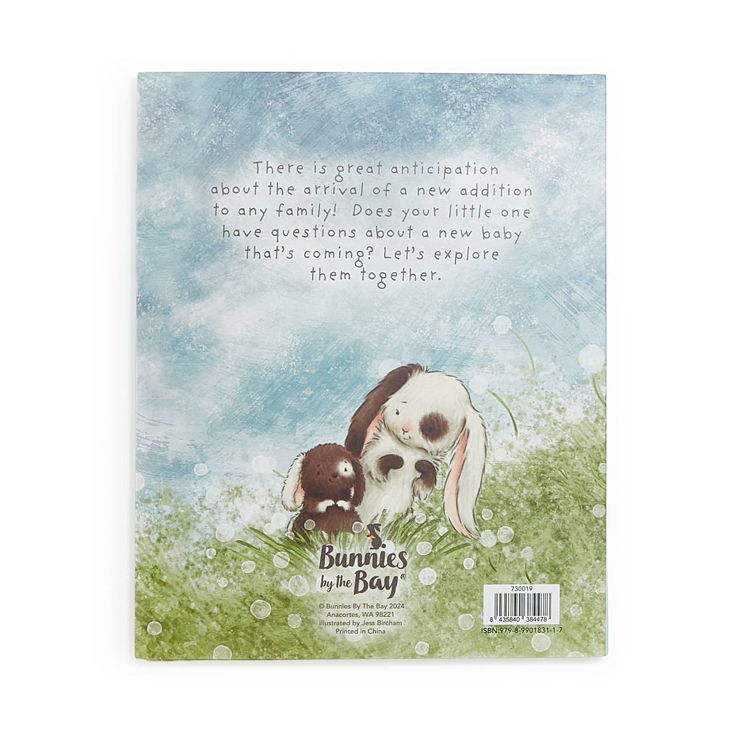 A Taste of Kentucky "Who Will Our New Baby Be?" story book cover featuring two bunnies, one white and brown, the other brown, in a grassy field with a soft blue sky.