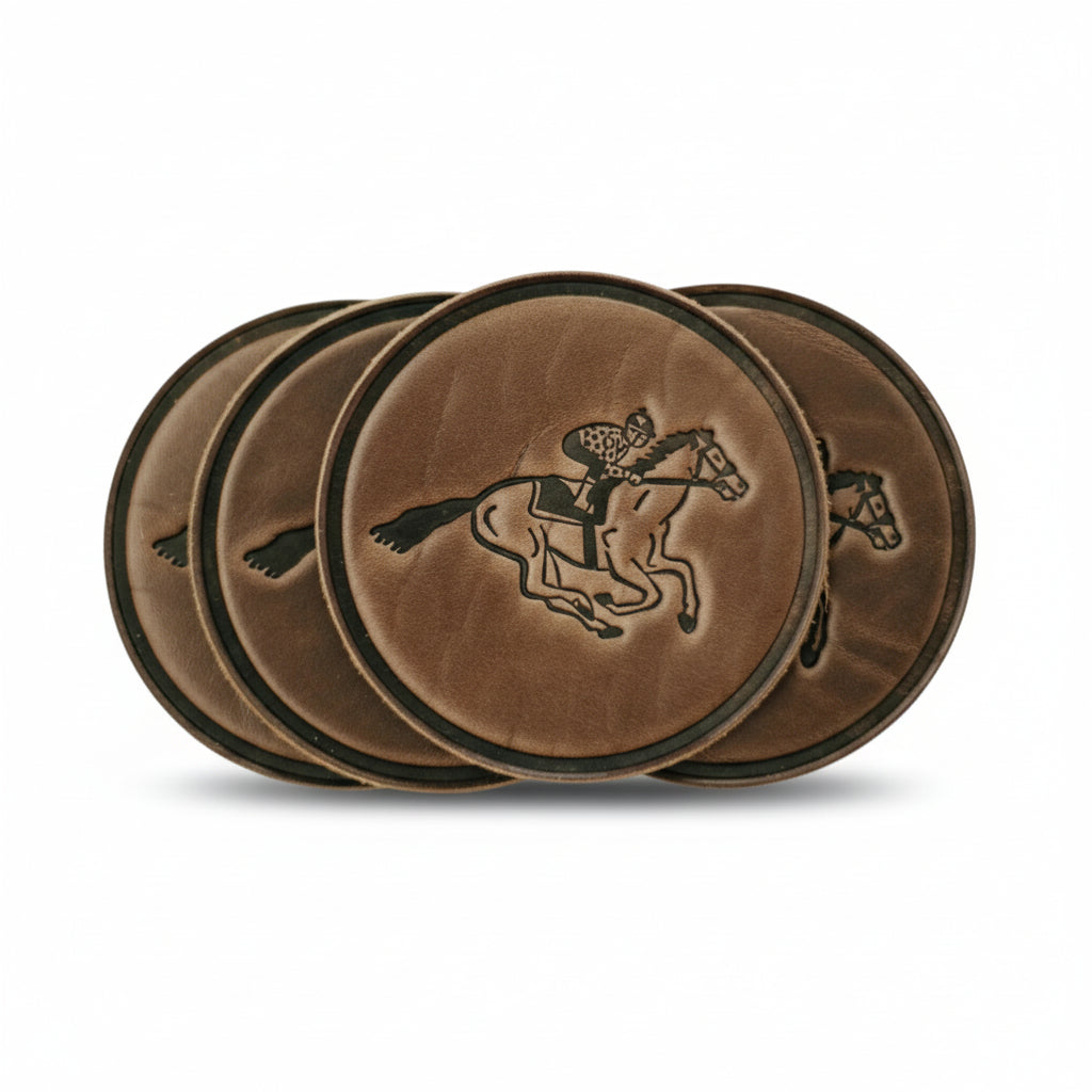 A set of four brown full-grain leather coasters arranged on a wooden table, each featuring a debossed jockey and racehorse design.