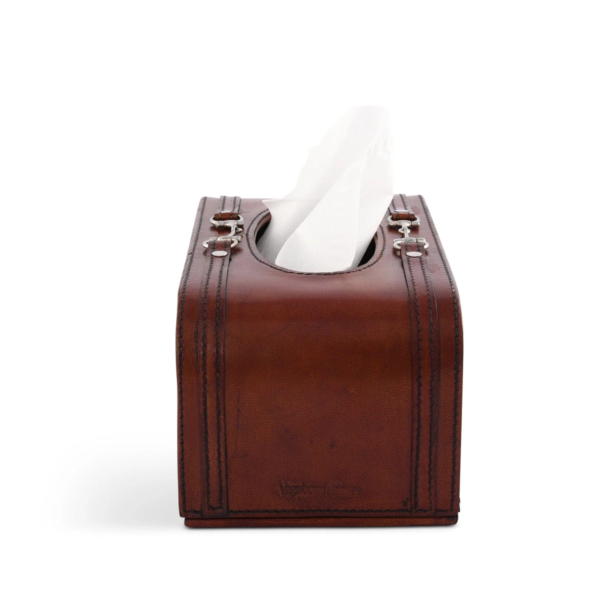 Brown leather tissue box cover with a white tissue on a white background