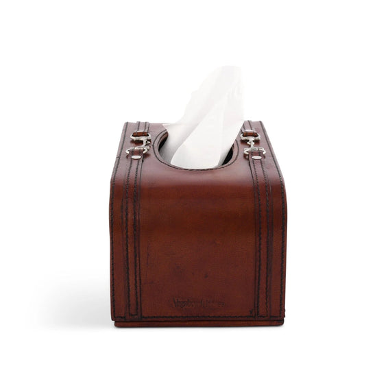 Brown leather tissue box cover with a white tissue on a white background