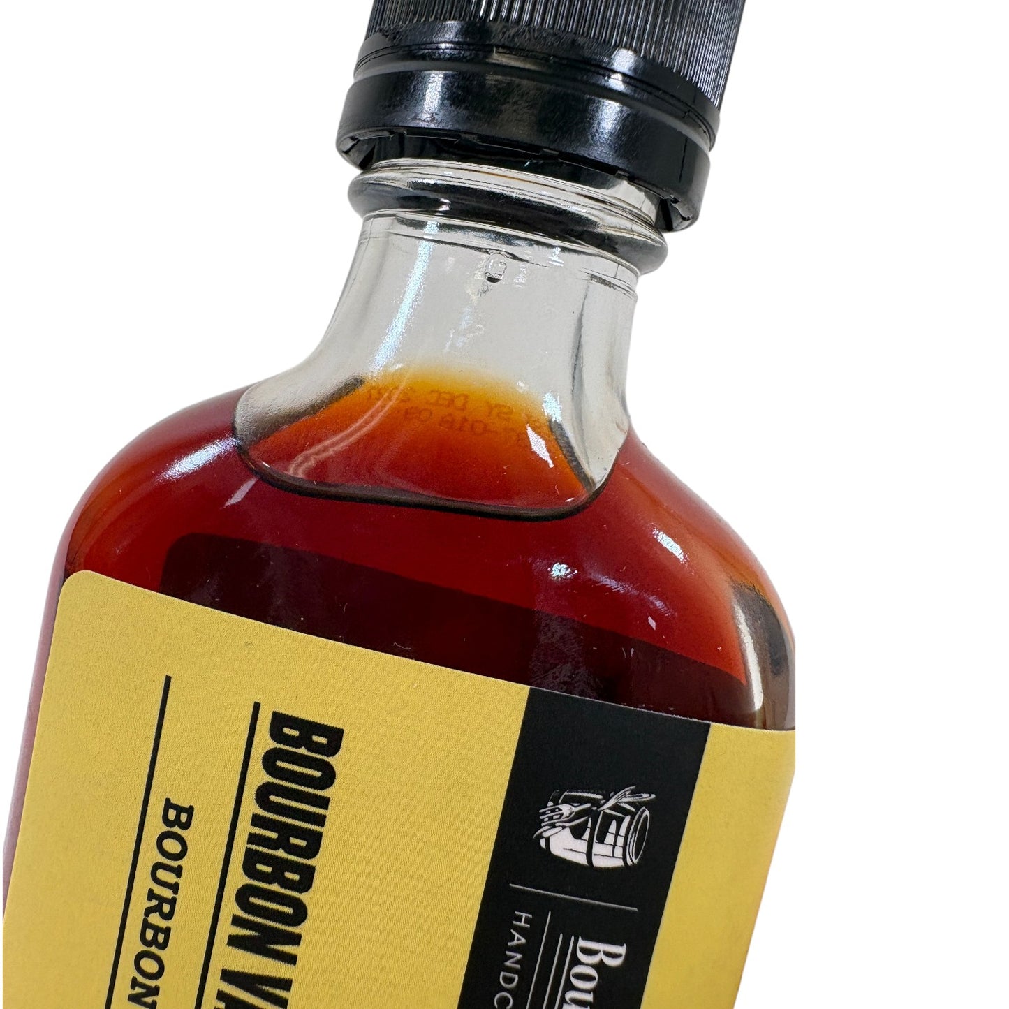 Bottle of Bourbon Vanilla Extract with a yellow label on a white background