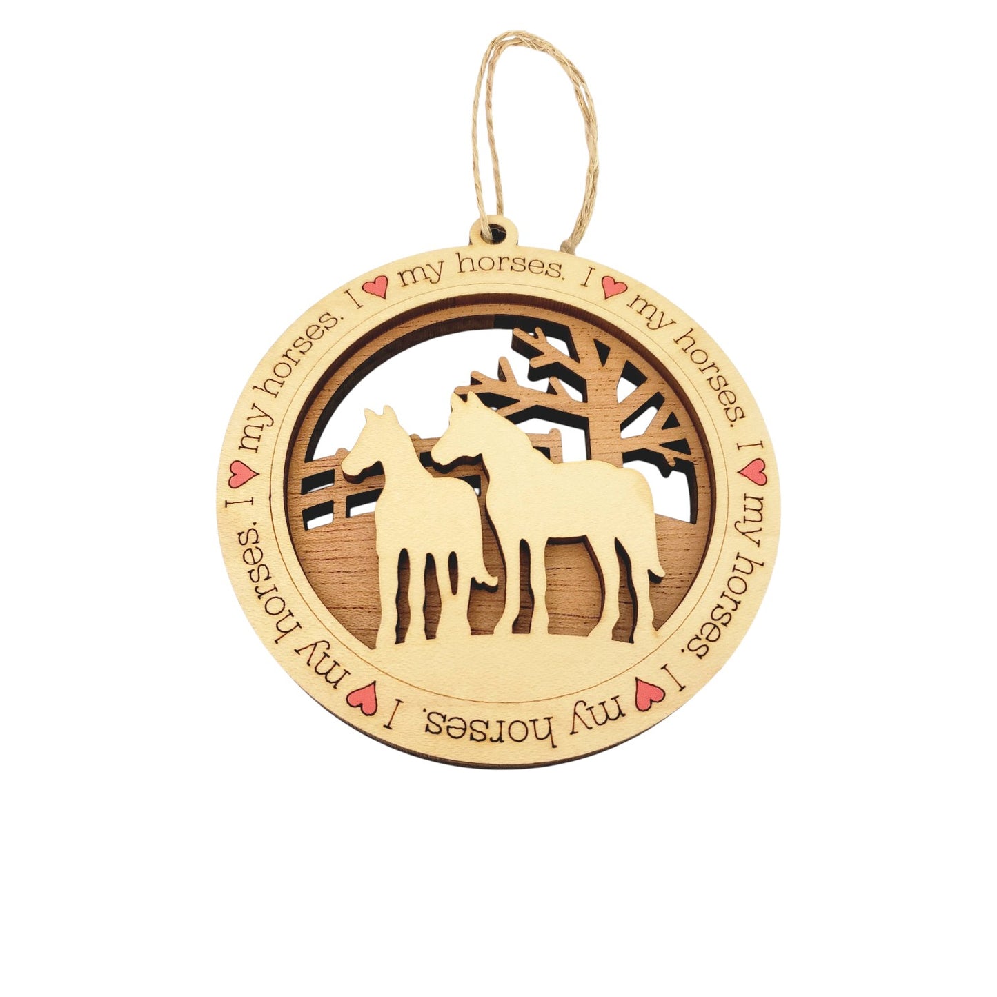 A layered wooden ornament showing a laser-cut maple foreground with the text "I Heart My Horses" over a mahogany background depicting two horses in a pasture.