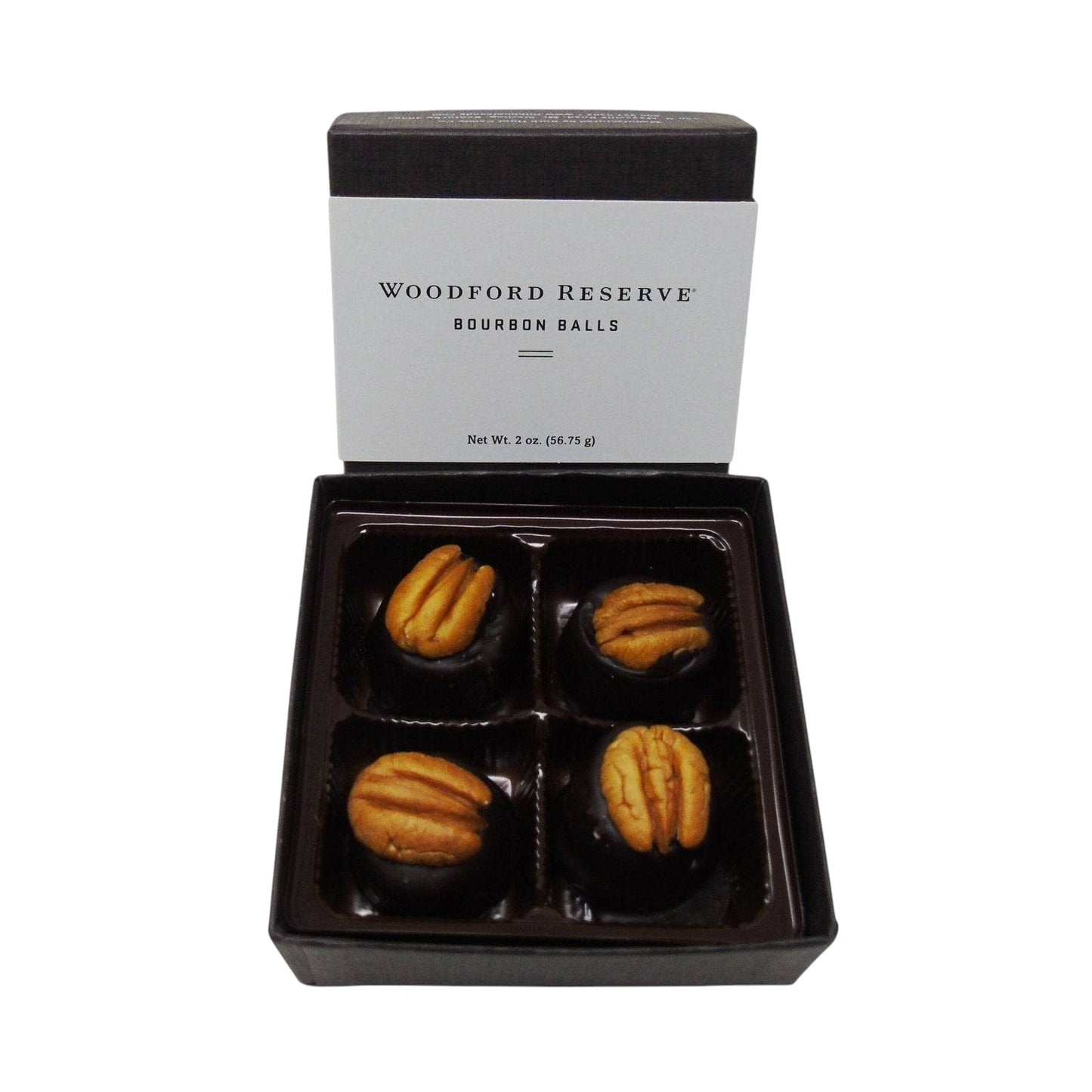 Woodford Reserve bourbon balls in a black box on a white background