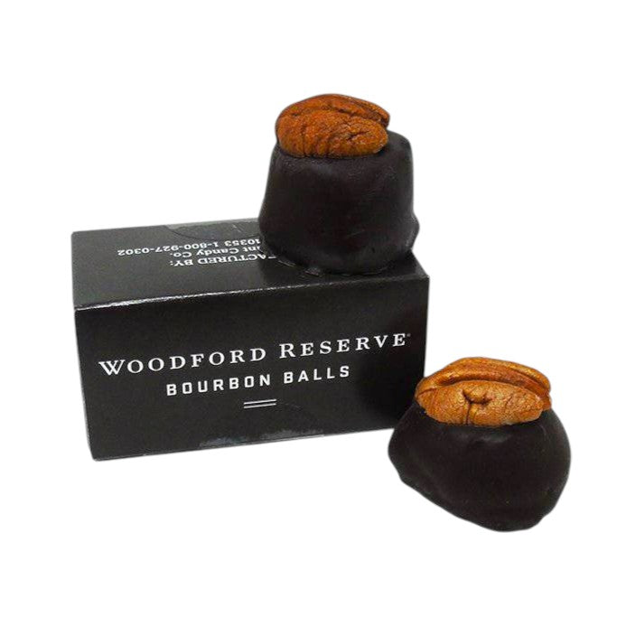 Woodford Reserve bourbon balls with packaging on a white background