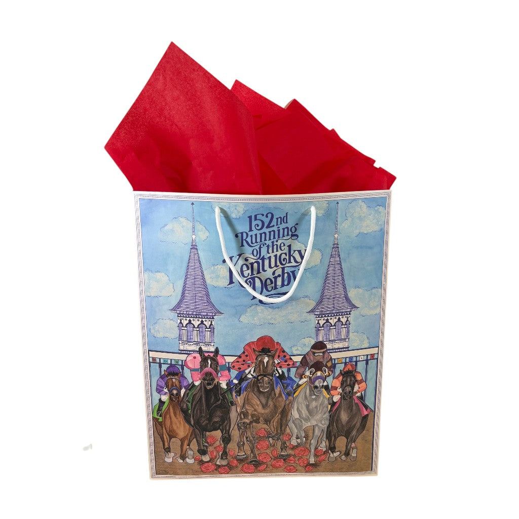 A close-up of the elegant Art of the Derby gift bag artwork, detailing jockeys, racehorses, a bed of red roses, and the iconic Twin Spires.