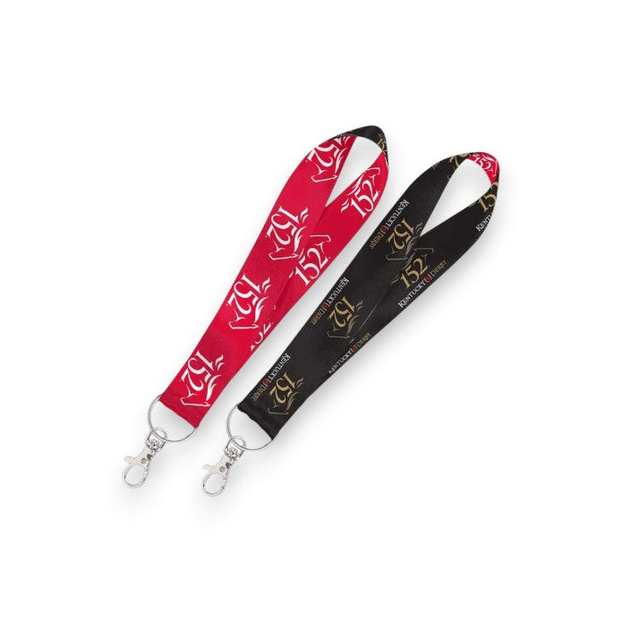 Two 1-inch lanyard key straps for the 152nd Kentucky Derby resting on a white background, featuring one red strap and one black strap, both adorned with repeating event text and silver swivel clasps.