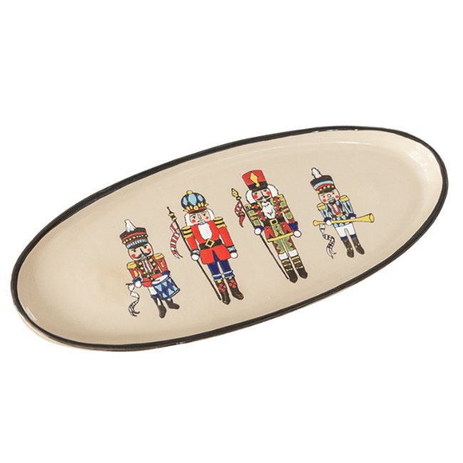 Nutcracker Antipasto Tray featuring four Nutcracker soldiers in festive colors on a stoneware platter, perfect for serving appetizers during the holidays.