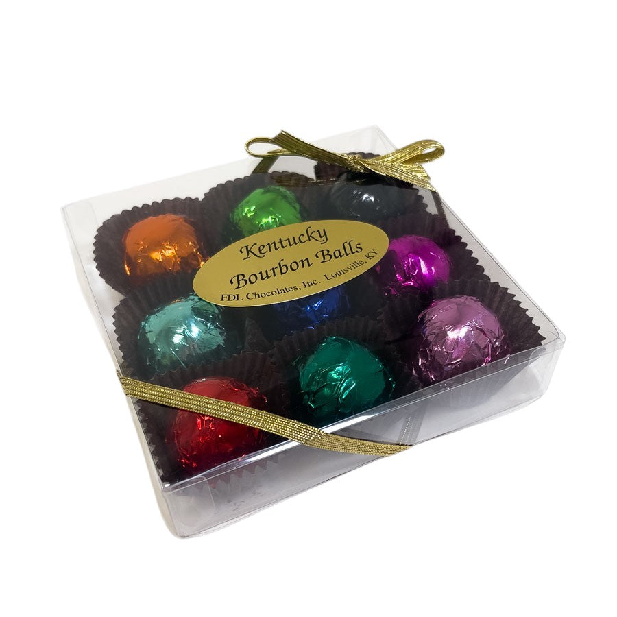 Box of colorful bourbon balls with a visible label on a white background