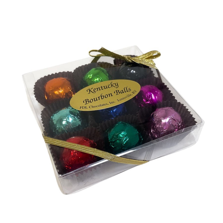 Box of colorful bourbon balls with a visible label on a white background