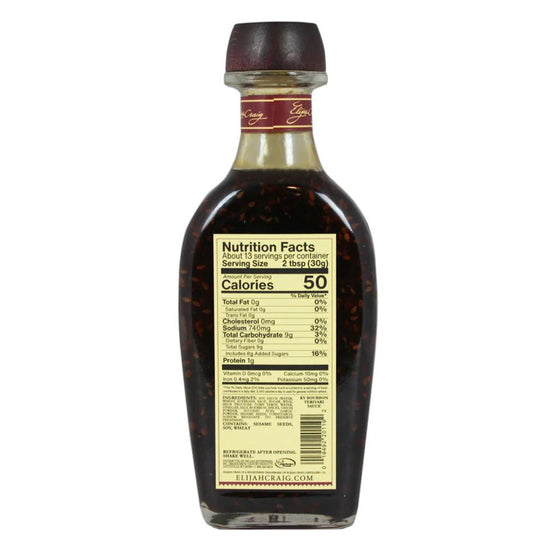 Bottle of syrup with nutrition facts label on a white background