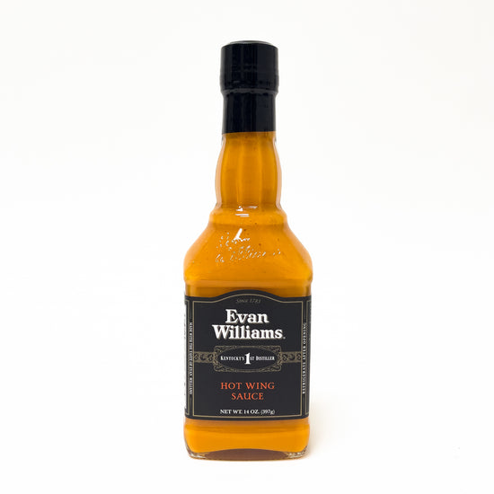 Bottle of Evan Williams hot wing sauce on a white background