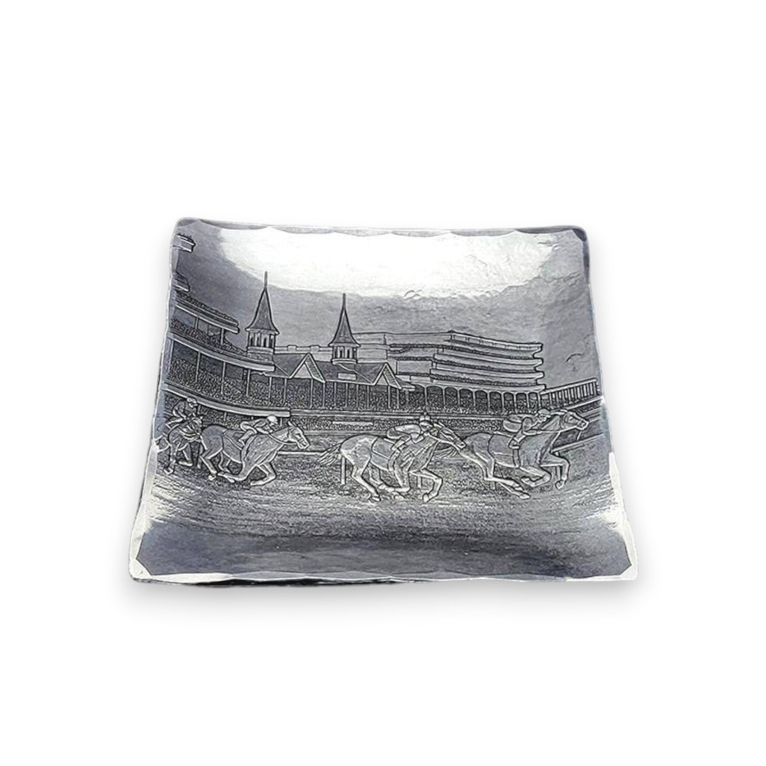The handcrafted aluminum Kentucky Derby Canape Tray showcasing the intricate design of running horses and the Churchill Downs Twin Spires.