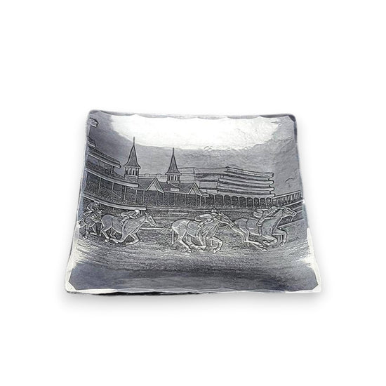 The handcrafted aluminum Kentucky Derby Canape Tray showcasing the intricate design of running horses and the Churchill Downs Twin Spires.