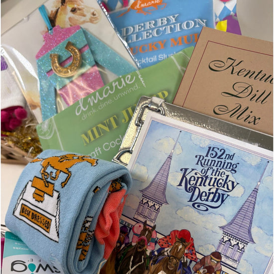 Collection of Kentucky Derby-themed items including a hat, socks, and the vibrant Art of the Derby 152 Postcard celebrating Kentucky racing traditions.