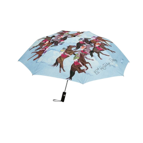 A light blue umbrella seen from above, showcasing the colorful, circular pattern of racehorses and jockeys from the Art of the Derby 152 collection.